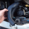 Заміна патрубка радіатора AutoMega 160098210 на Opel Vectra B (відео)